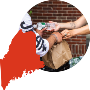 Collaged image showing the shape of Maine in red-orange, next to a circular cropped photo of a woman handing a bag of food and bottle of water to a man.